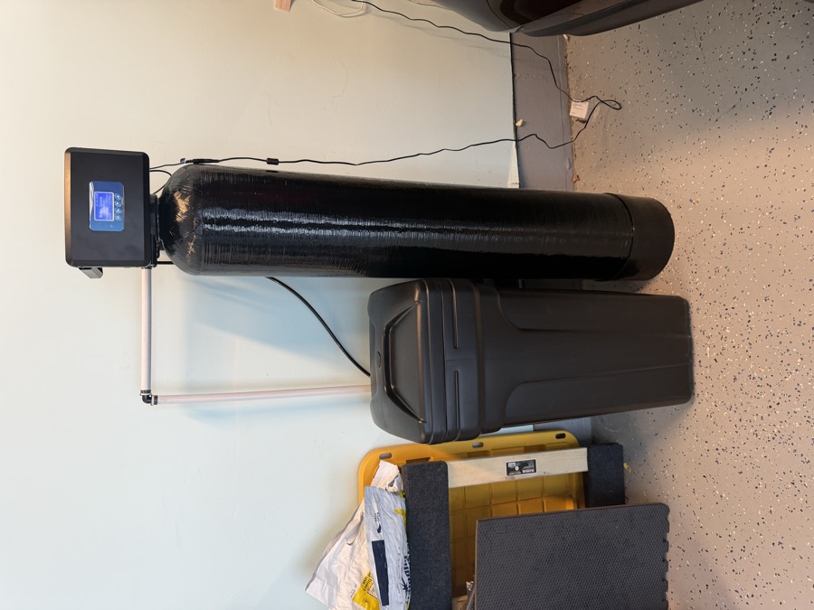 Water softener and brine tank installed in a garage